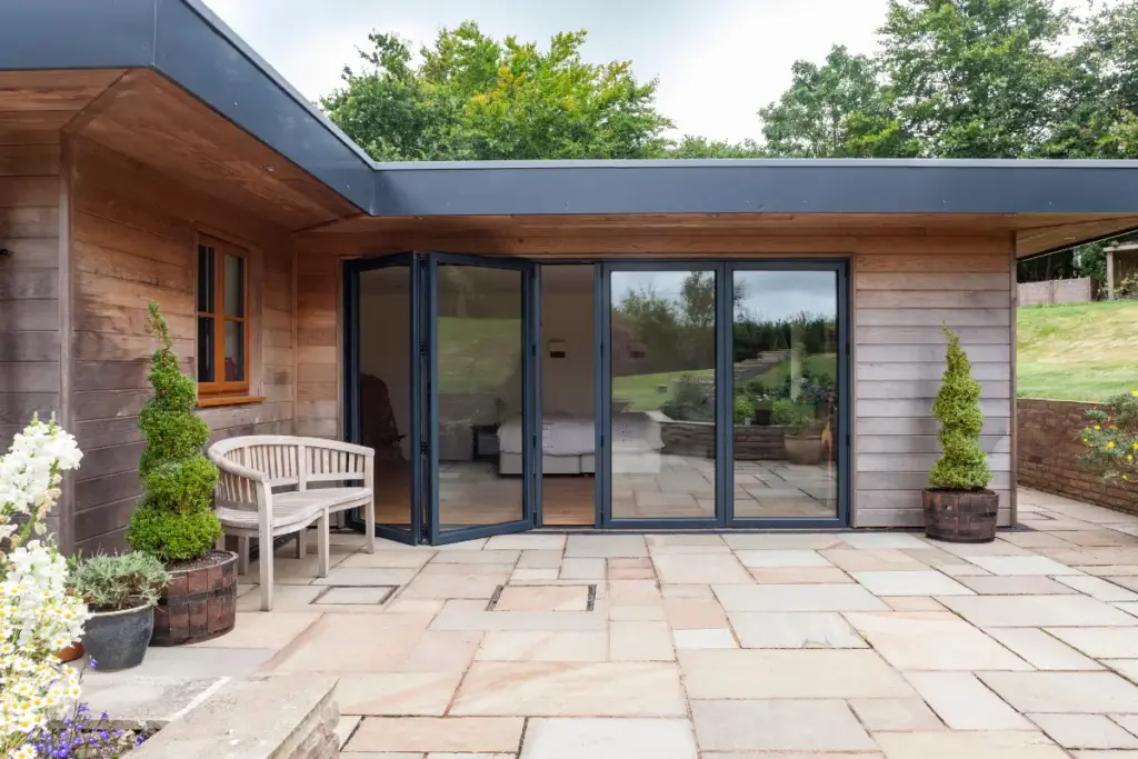 Aluco aluminium bifold doors installed in a contemporary single-storey extension in the UK