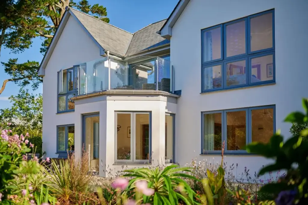 Modern UK home with contemporary aluminium windows and glazed balcony