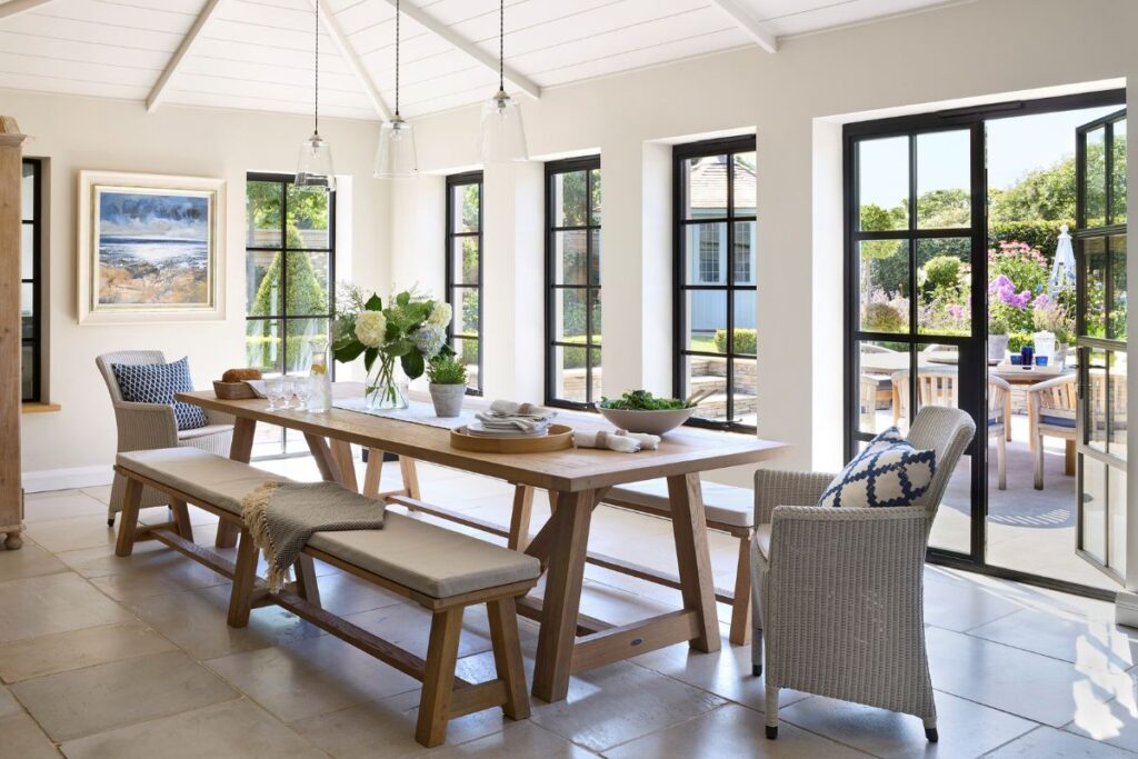 Aluco steel-look aluminium windows Buckinghamshire in a bright open-plan dining space with garden views