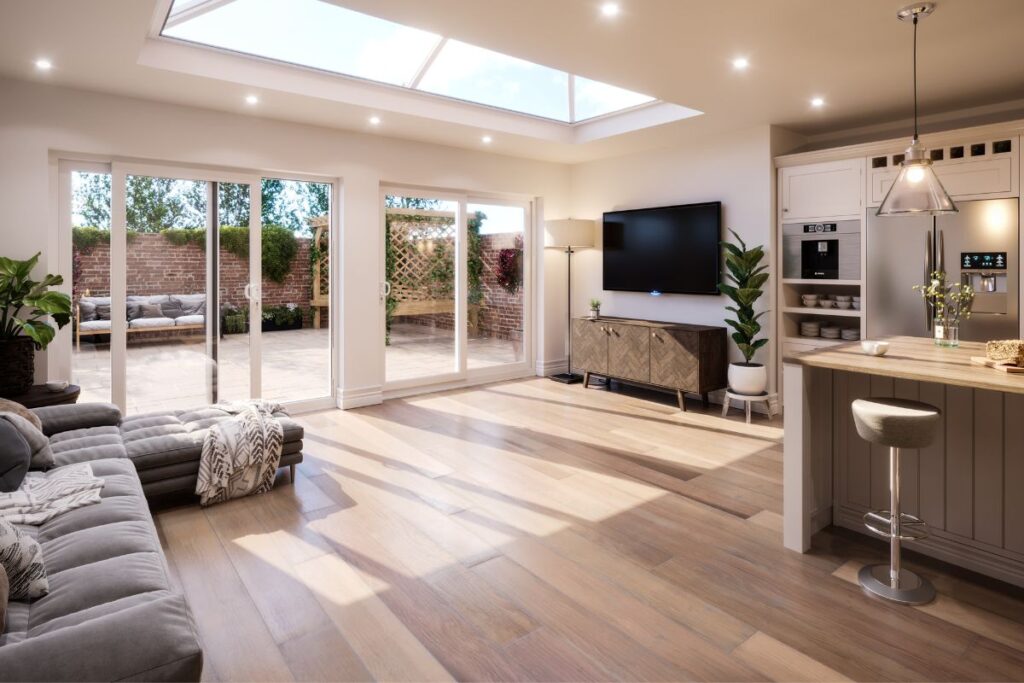 White uPVC sliding doors opening onto a garden patio in a Milton Keynes open plan living space